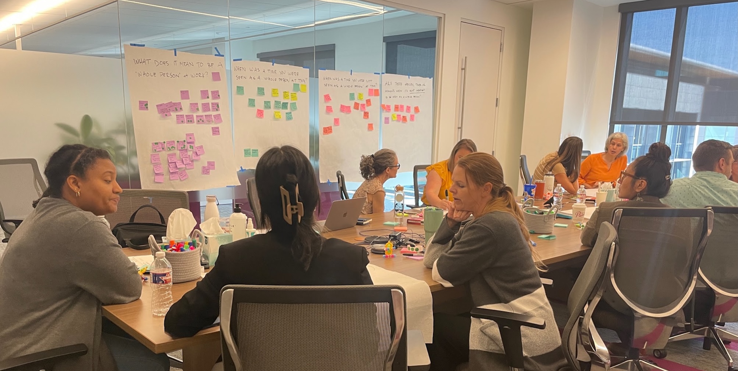 Workshop participants collaborating on research activities to support designing insurance systems that better work for people.