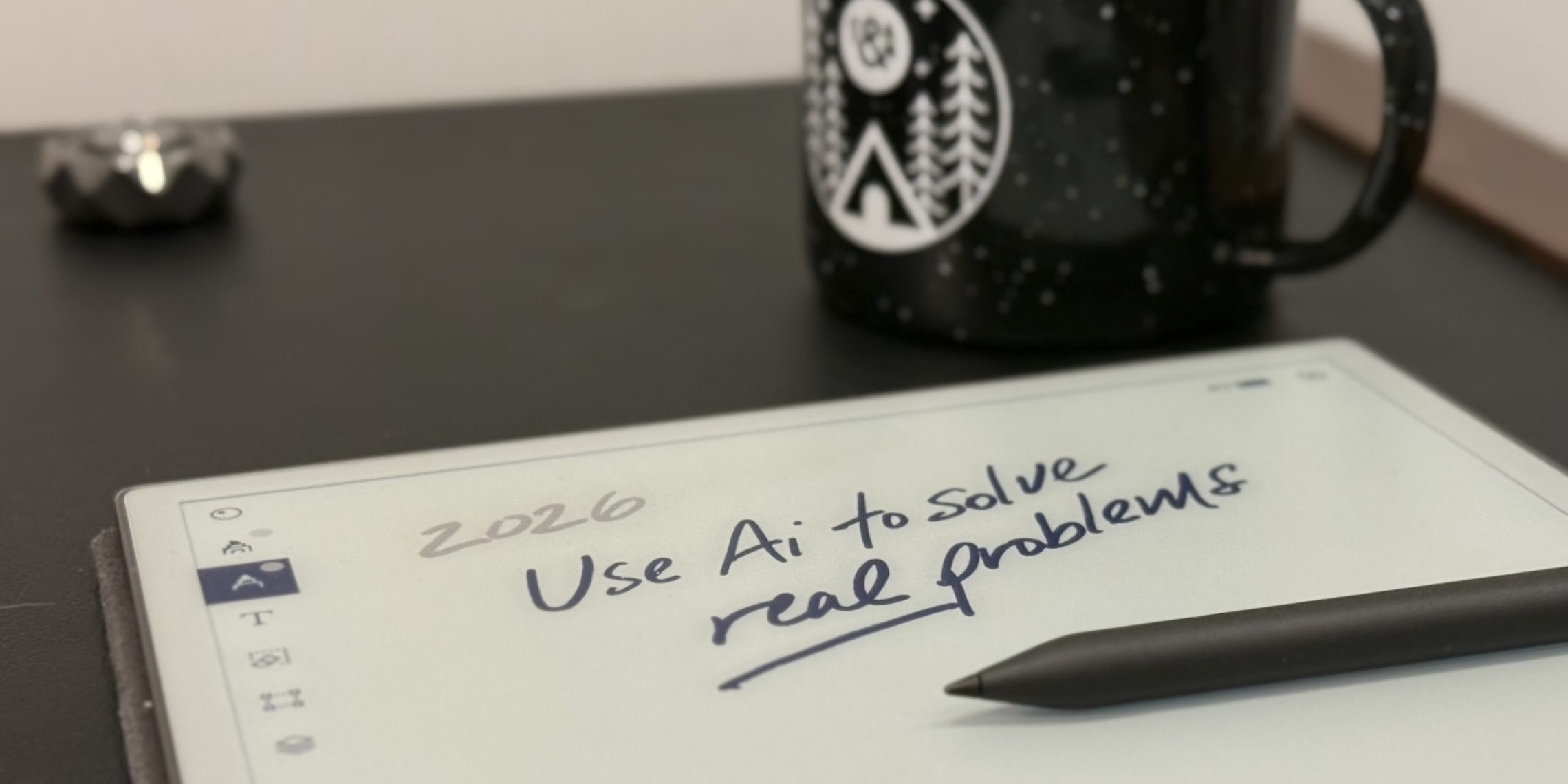 pen tablet on a table with a New Year's Resolutions for insurance written on it, saying use AI to solve real problems