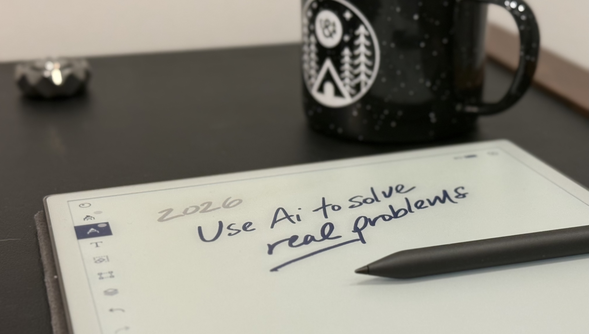 pen tablet on a table with a New Year's Resolutions for insurance written on it, saying use AI to solve real problems