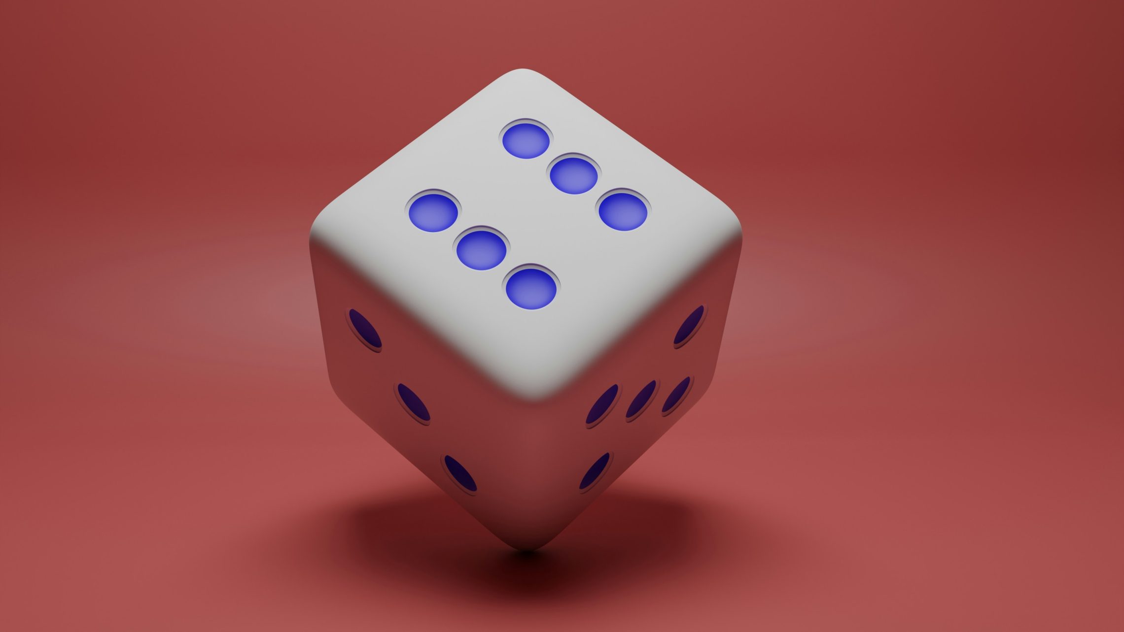White die on red background, representing how insurance can feel like gambling